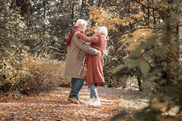 Delighted nice couple of pensioners dancing waltz - Foto, Bild