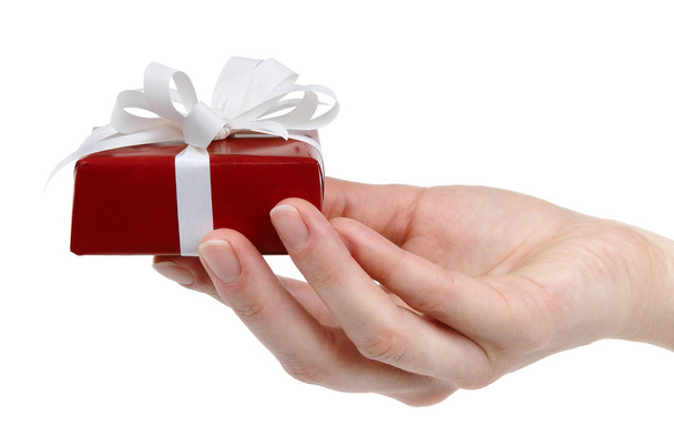 Hands holding Christmas gift on a white background, isolated - Foto, Imagem