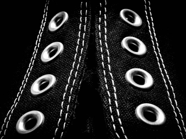 High contrast close-up detail of black Converse shoe from the front side - Photo, Image