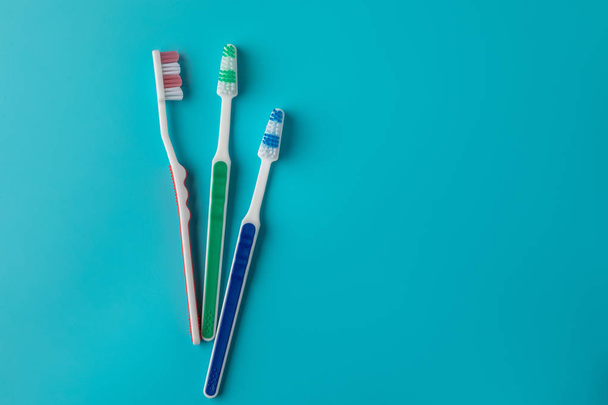 Toothbrushes on blue background - Foto, imagen