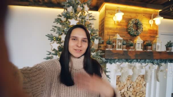 Point of view shot of cheerful woman looking at camera and talking on Christmas day showing gift box expressing positive emotions and enjoying communication. - Imágenes, Vídeo