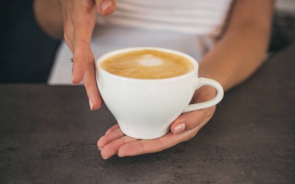 barista propose americano or espresso cup. relax in cafe or coffee shop and drinking. perfect morning with best coffee. fresh morning coffee with milk and cream froth. Five minutes for coffee - Φωτογραφία, εικόνα