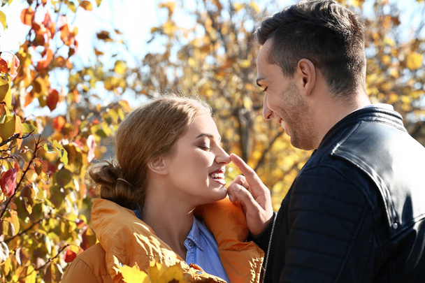 Loving young couple in autumn park - Zdjęcie, obraz