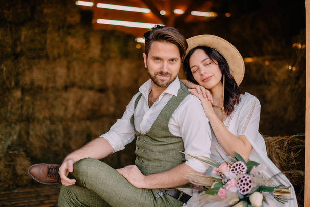 portrait of newlyweds in boho style at ranch - Zdjęcie, obraz