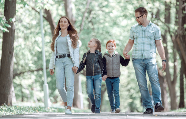 modern family on a walk in the Park - Photo, image