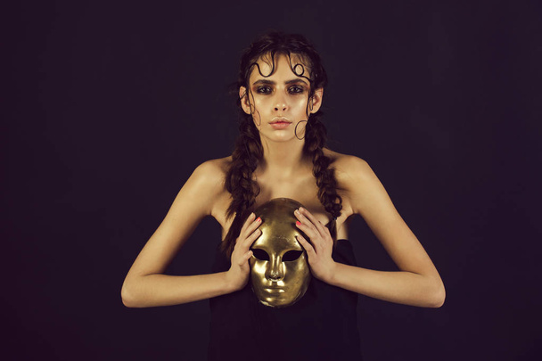 cute girl holding golden, carnival, face mask - Foto, immagini