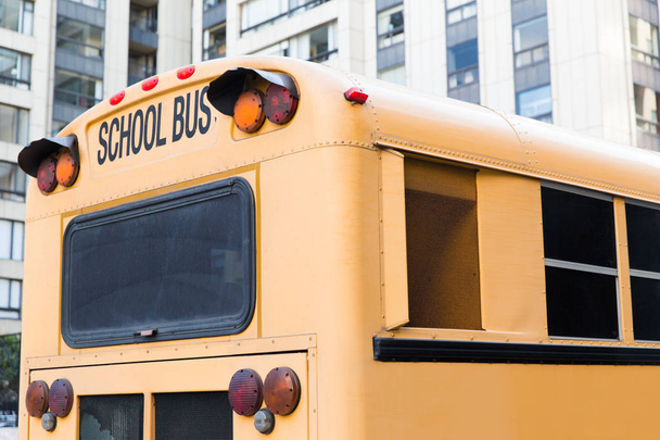 close up of american schoolbus on city street - Foto, Imagem