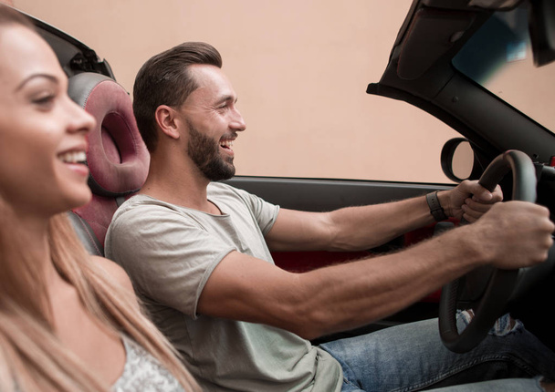 couple in love in a convertible car - 写真・画像