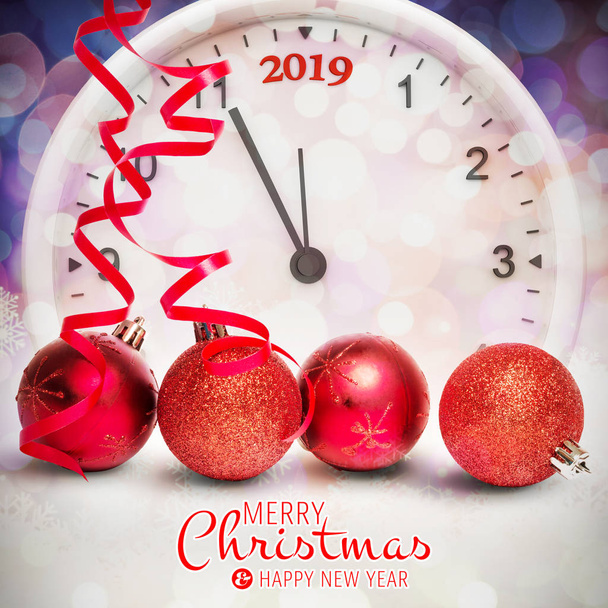 Merry christmas message against red baubles and clock  - Φωτογραφία, εικόνα