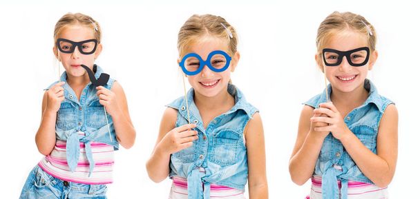 Set of little girl holdind mask glasses isolated - Фото, изображение