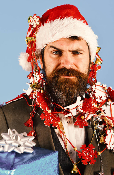 Christmas corporate party concept. Man in smart suit, Santa hat - Fotoğraf, Görsel