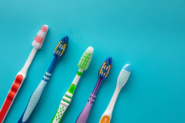 toothbrushes in the form on a blue background - Zdjęcie, obraz