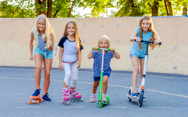 little girls compete riding in the skatepark - Photo, image