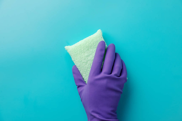 Female hands cleaning on blue background. Cleaning concept background. Flat lay, Top view. - Foto, imagen