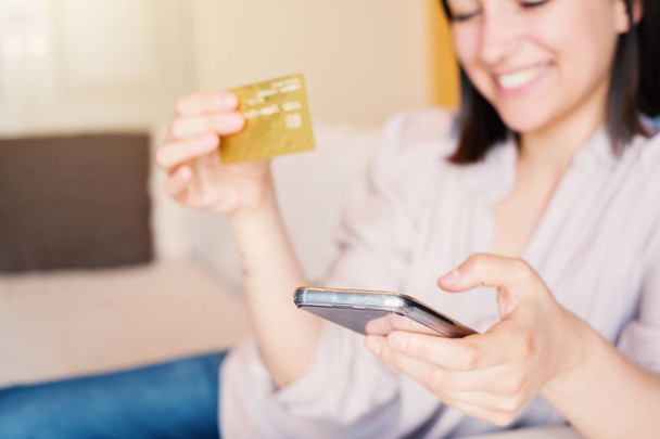 Young woman portrait using credit card online - Photo, Image