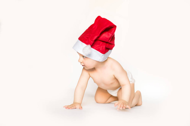 Xmas card with cute baby girl in red hat - Fotó, kép