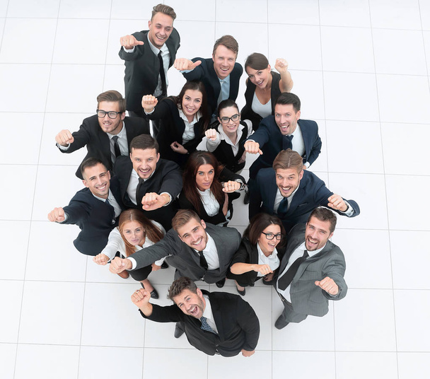 concept of success. business team raising hands and looking at camera. - Valokuva, kuva