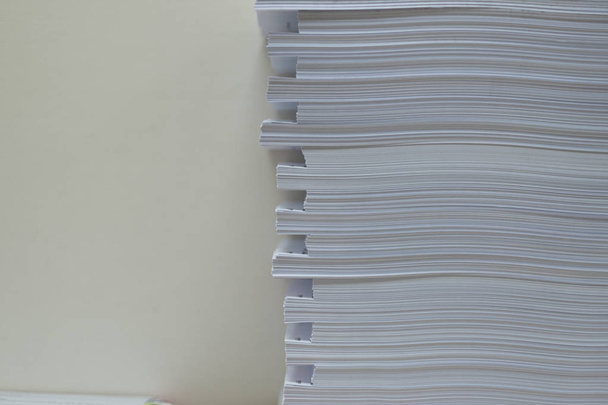 Pile of unfinished documents on office desk folders. Business papers or document is written. Business offices concept. - Photo, Image