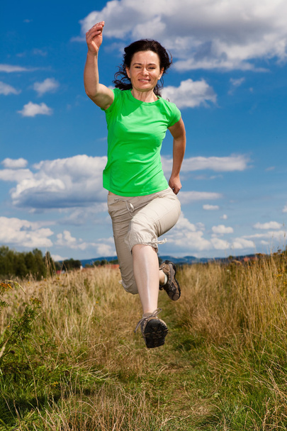 Woman jumping, running outdoor - Photo, Image