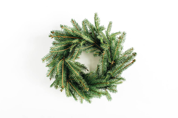 Christmas, New Year wreath frame made of fir branches on white background. Flat lay, top view blog hero header. - Фото, изображение
