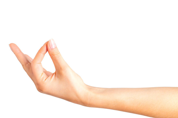 Woman hand showing mudra gesture or holding something. - Foto, immagini