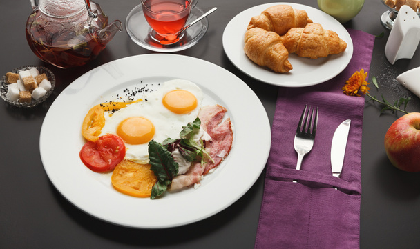 Restaurant breakfast with bacon and fried eggs - Photo, Image