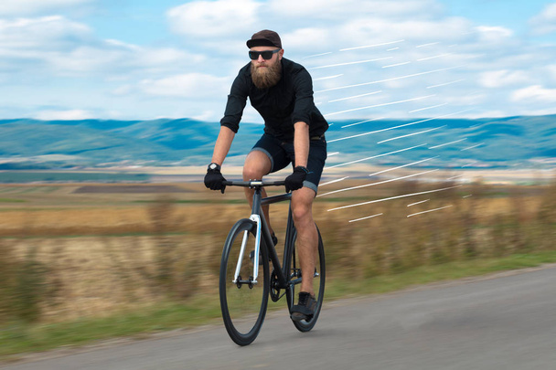 Casual cyclist riding bicycle very fast - Photo, Image