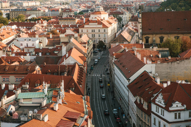Beautiful aerial view of the traditional old or medieval architecture in Prague in the Czech Republic. Road with cars. Everyday city life. - Zdjęcie, obraz