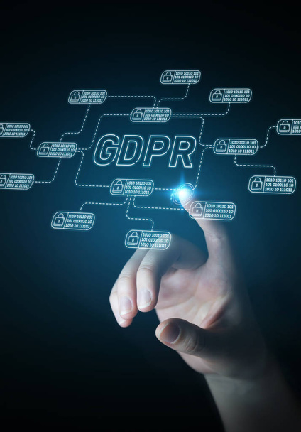 Businesswoman on blurred background protecting her datas with GDPR law interface - Photo, image