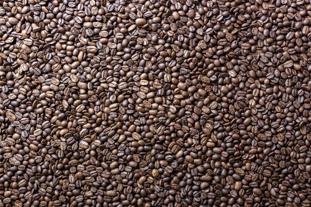 Coffee beans on the table background blurred abstract background blurred abstract background - Photo, Image