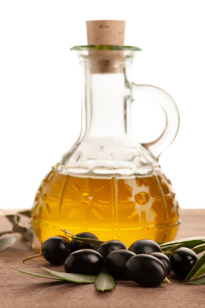 Bottle of olive oil isolated over white background . - Foto, afbeelding