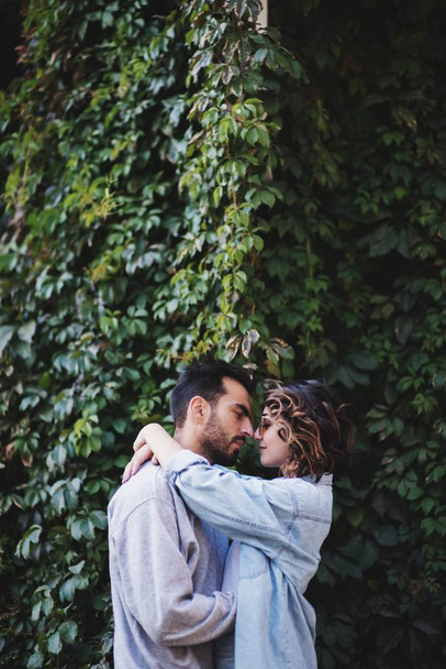 Romantic couple in love embracing and looking at each other - Фото, изображение