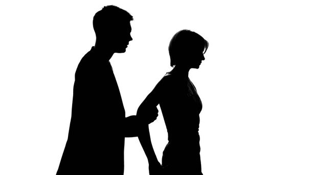 Male holding female, stopping from walking away during conversation, crisis - Photo, Image