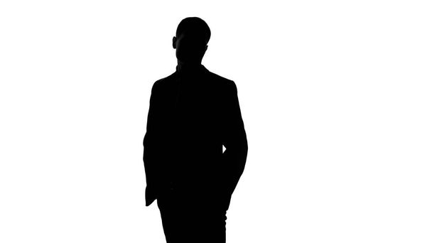 Elegant businessman in suit waiting for meeting, put hands in pockets, confident - Fotó, kép