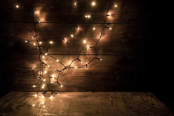 christmas lights on wooden background - Photo, Image