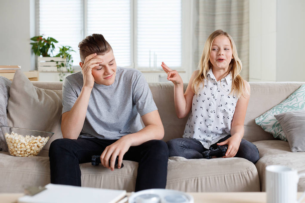 Brother and sister spending time together at home, having an argument.  - Фото, зображення