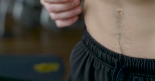 close up video of man abdomen, running on treadmill, slow motion video - Footage, Video