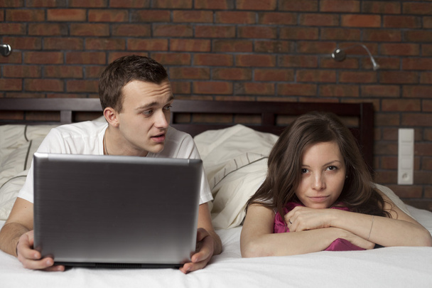 Young couple using laptop - Photo, image