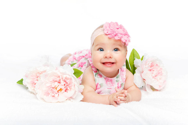 happy beautiful baby girl with flower on head - Photo, Image
