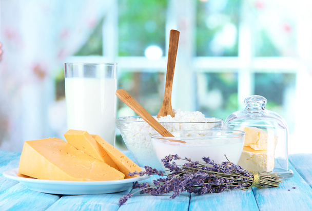 Glass of milk and cheese on bright background - Φωτογραφία, εικόνα