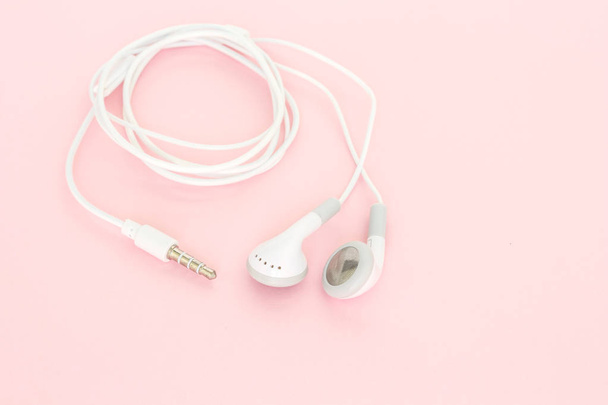 earbuds or earphones on pink background - Photo, Image