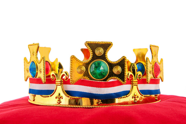 Golden crown on velvet pillow with Dutch flag - Valokuva, kuva