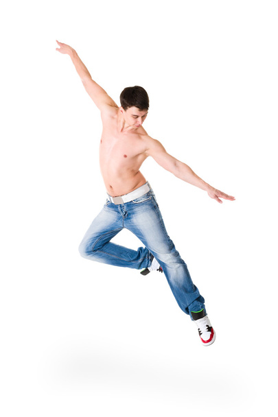 Young handsome man in blue jeans jumping - Foto, Imagen