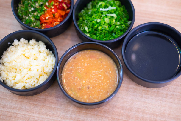 Set of Sauce for Shabu shabu style in black bowl, top view - Photo, Image