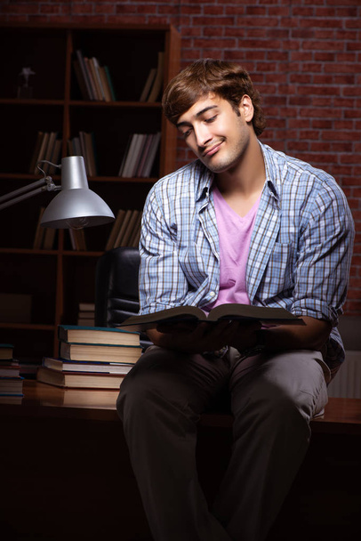 Young handsome student preparing for exams at night  - Photo, Image