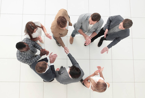 top view.business team and handshake of business partners - Фото, зображення