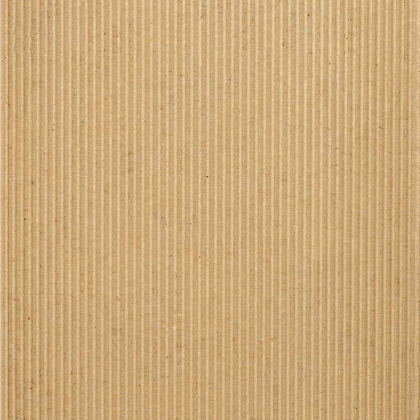 Brown corrugated cardboard sheet useful as a background, soft pastel colour - Photo, Image