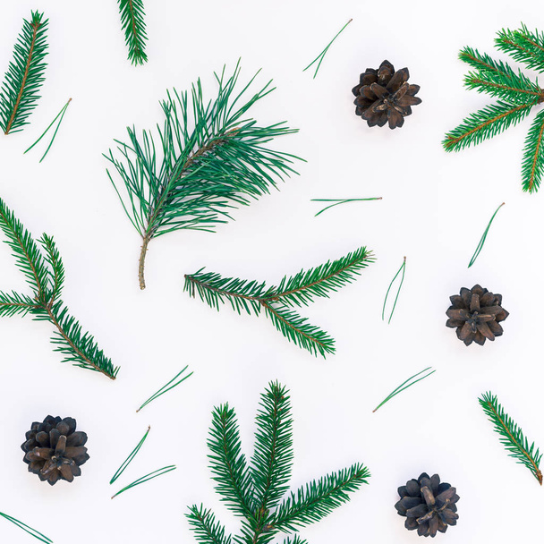 New Year Christmas pattern flat lay top view Xmas holiday handmade handicraft texture with fir tree pine branches cones white background copy space Template for greeting card text design - Photo, Image