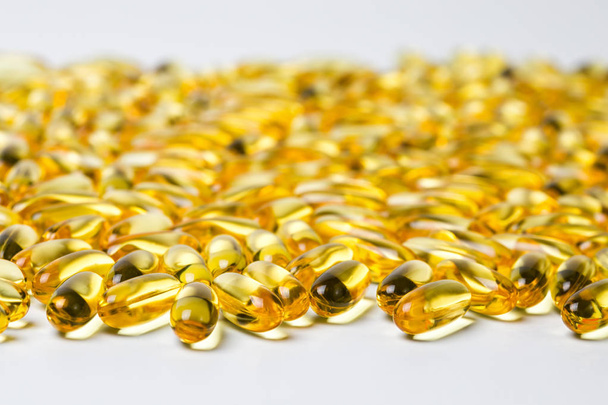 Photo of yellow healthy fish oil in drugs - Foto, Imagen