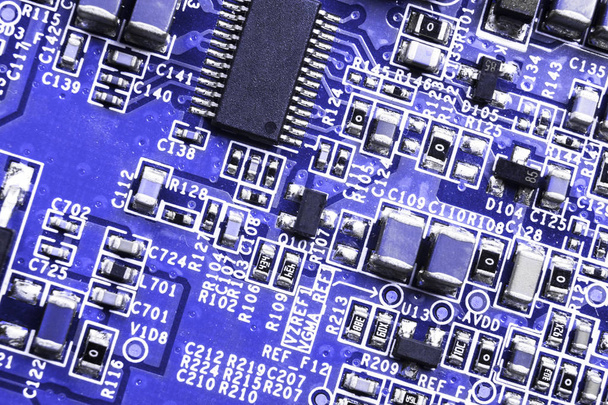 Macro shot of a Circuitboard with resistors microchips and electronic components. Computer hardware technology. Integrated communication processor. Information engineering. Semiconductor. PCB. Closeup - Valokuva, kuva